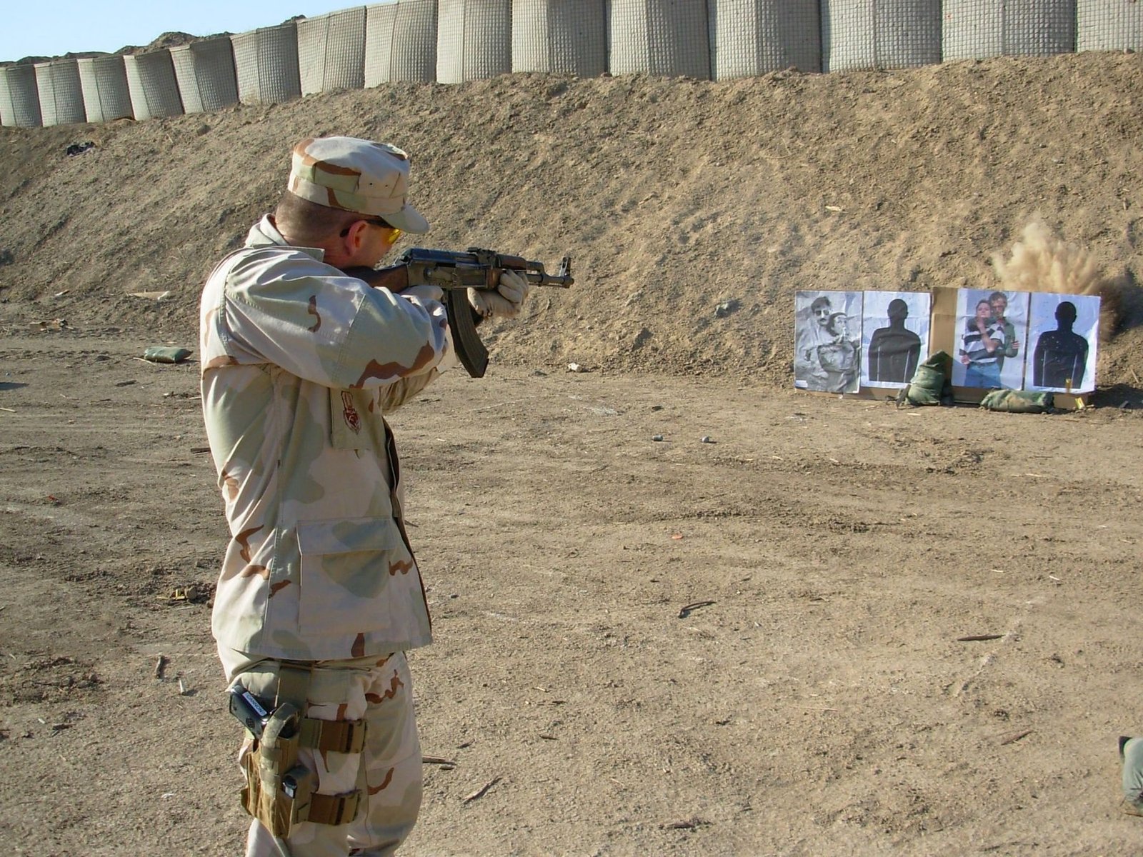 Michael Cannon firing a rifle at a training range while deployed with the United States military